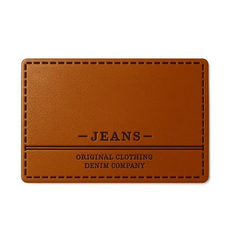 Brown leather label for 'JEANS ORIGINAL CLOTHING' sewn onto denim, demonstrating a classic application.