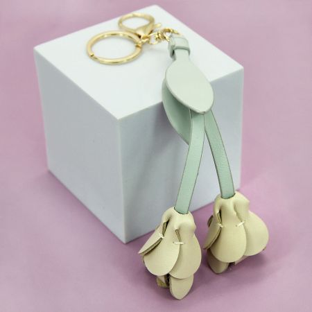 Soft beige PU leather flower keychain, an elegant and minimalist accessory for women.