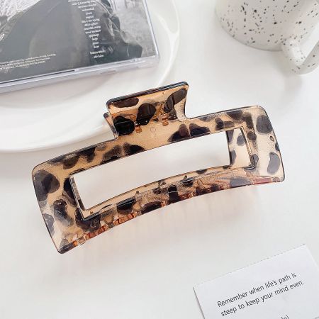 Stylish large hair claw clip with a classic leopard print design.