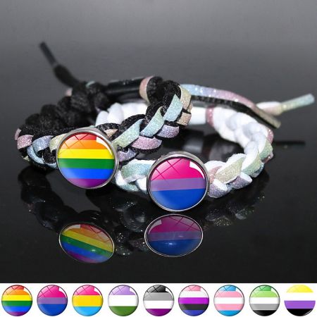 A collection of LGBTQ+ pride bracelets with heart charms, including rainbow and bisexual flag designs.