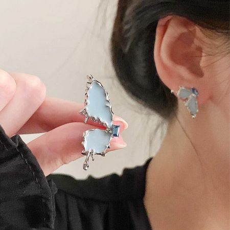 Unique design variation of the butterfly earrings with a creative melted silver edge effect.