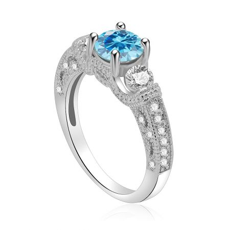 Side view of the aquamarine engagement ring, showcasing the central light blue gemstone and surrounding clear stones on the silver band.