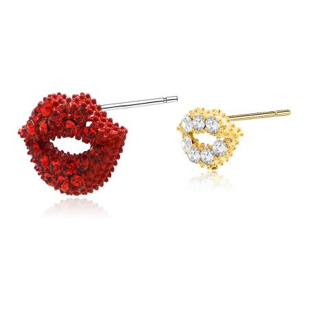 Close-up view of the asymmetry red and gold lip-shaped stud earrings with gemstone details.