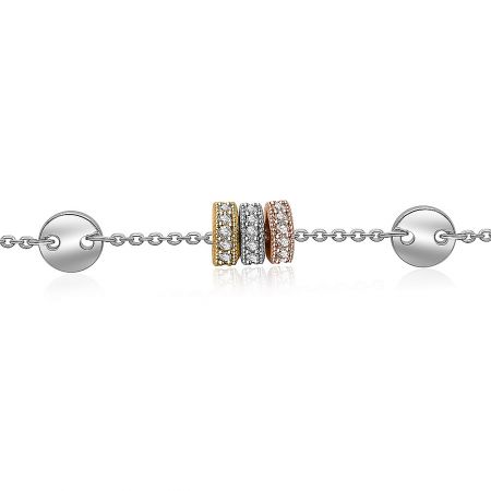 A luxury shot of the three-tone charm bracelet, highlighting the gemstone-encrusted centerpiece.