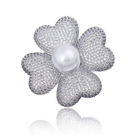 Rhinestone Cloverleaf Brooch With Pearl - A close-up of the Rhinestone Cloverleaf Brooch, showcasing its four sparkling cubic zirconia petals, central white pearl, and polished rhodium-plated brass finish.