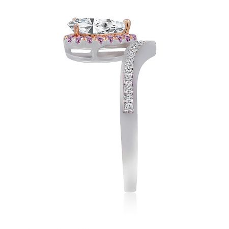 Side profile of the two-tone engagement-style ring, displaying the intricate rose gold setting and band details.