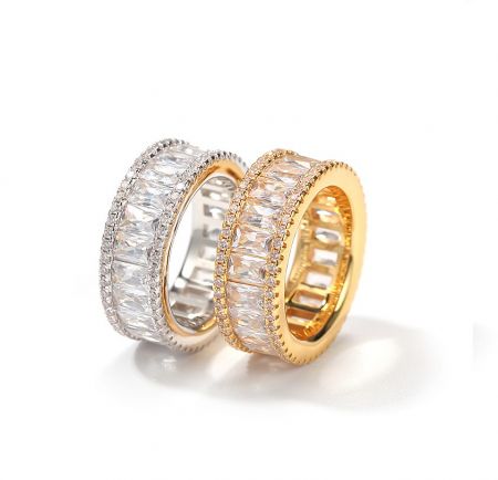 A pair of luxury hip hop baguette rings showcasing the rectangular gemstone setting.