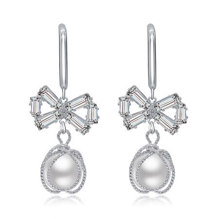 Chic Bow Pearl Hook Earrings - Chic Bow Pearl Hook Earrings featuring flower-shaped tops with baguette-cut clear gemstones and elegant teardrop-shaped pearls.