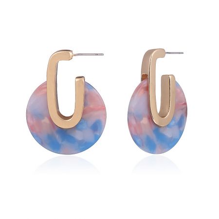 Detailed view of the marbled pink, blue, and white resin discs on the geometric hoop earrings.