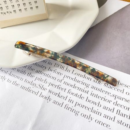 Close-up of a hair clip with a beautiful marbled acetate pattern.