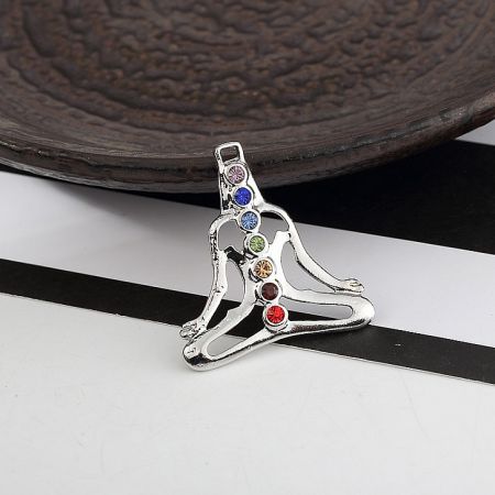 Custom 7 Gemstone Buddha Yoga Meditation Reiki Chakra Charm - A silver pendant depicting a meditating figure with seven vertically aligned colored gemstones representing the chakras, symbolizing spiritual balance.