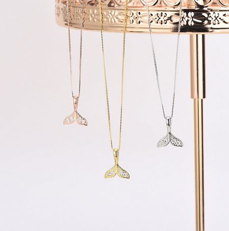925 Sterling Silver Mermaid Tail Necklace - A collection of three 925 Sterling Silver Mermaid Tail Necklaces displayed side-by-side, showcasing the available finishes in silver, gold, and rose gold.