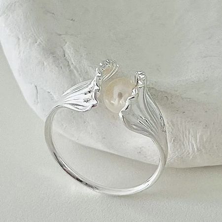 Unique mermaid tail inspired silver ring with a pearl, highlighting the creative design of the adjustable ring set.