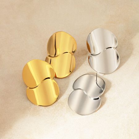 Product shot of the chunky geometric earrings in both gold and silver.