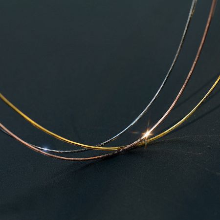 Close-up of the 925 silver snake chains in gold, silver, and rose gold finishes.