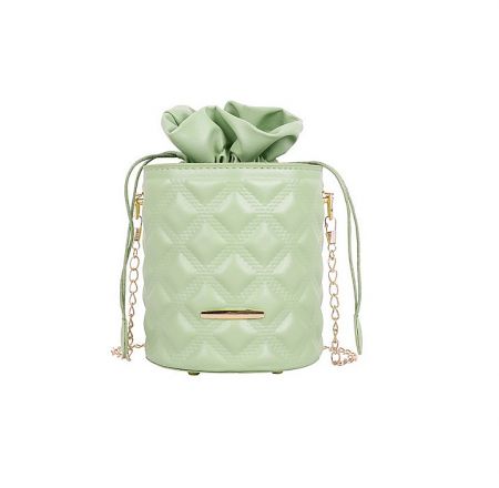 Chic mint green leather bucket bag with a quilted pattern and gold accents.