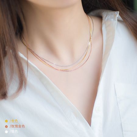 925 Simple Women Snake Chain Necklace Set of 5 - Model wearing the 925 sterling silver snake chain necklace set, showcasing the layered look with gold, rose gold, and silver tones.