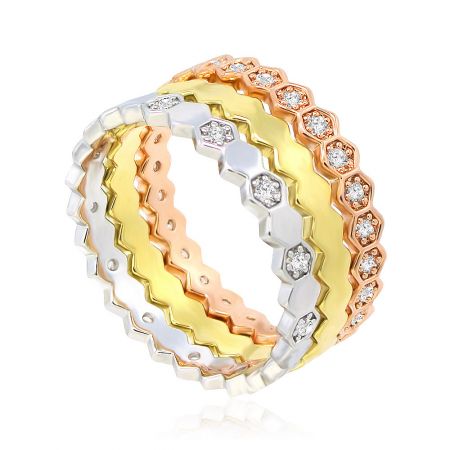 Detailed view of the multi-layered, diamond-studded ring set in silver, yellow gold, and rose gold with a unique zig-zag pattern.