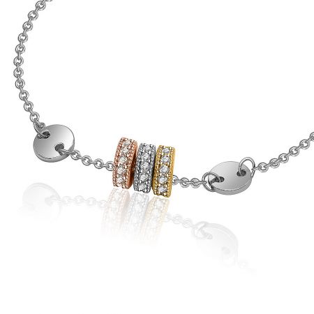Detailed view of the multi-toned metal bracelet showcasing the sparkling cubic zirconia accents.