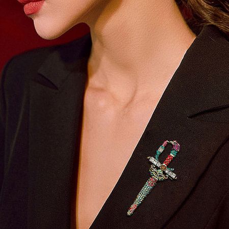 Rhinestone Retro Sword Crystal Brooch for Men Suits (5 pcs) - A stylish rhinestone retro sword crystal brooch with multicolored beads pinned to the lapel of a black suit jacket, showcasing its elegant and bold design.