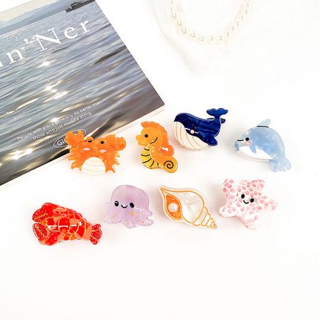A delightful assortment of sea animal hair clips including a starfish, shell, and octopus.