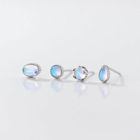 Assorted Moonstone Stud Earrings in 925 Sterling Silver (Set of 5 Pairs) - A collection of four pairs of 925 sterling silver stud earrings with iridescent moonstones, showcasing various elegant designs.