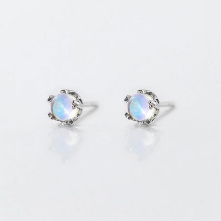 A simple yet elegant pair of opal stud earrings in a classic sterling silver setting.
