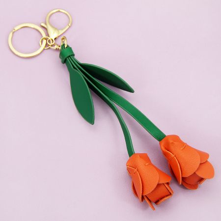 Fresh orange PU leather tulip bag charm with a secure gold-tone clasp, sold in a wholesale set.