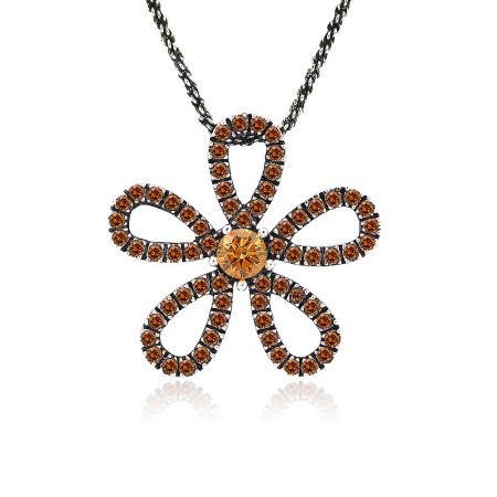 A close-up shot of the orange gemstone flower pendant, highlighting the crystal details.