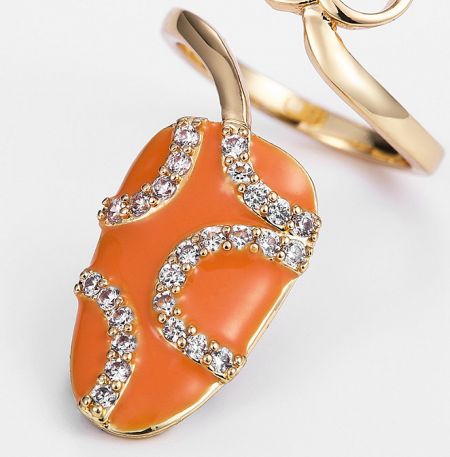 An elegant orange and gold pendant necklace with diamond details, showcasing the craftsmanship available.