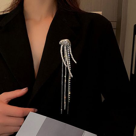 Elegant Korean-style pearl tassel and crystal jellyfish brooch pinned on a black blazer.