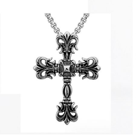 Detailed ornate silver cross pendant with intricate fleur-de-lis designs on a matching chain.