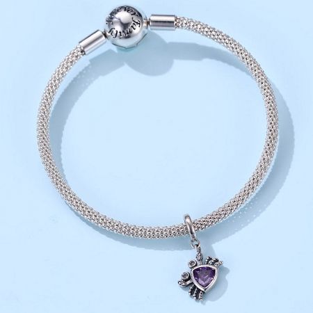 A Pandora-style charm bracelet featuring the purple crab charm alongside other charms.