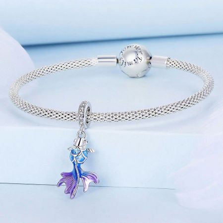 A Pandora-style silver bracelet featuring an ocean-themed mermaid charm.