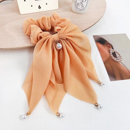 Trendy Japanese Ruffles Pearl Ribbon Hair Tie Scrunchies (5 pcs) - A close-up of a trendy peach-colored Japanese style ruffle hair scrunchie, elegantly detailed with a delicate pearl ribbon.