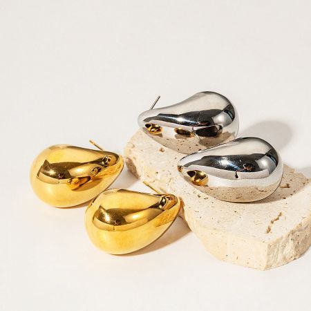 Multiple pairs of the stainless steel teardrop earrings arranged to display their consistent shape and high-polish finish.
