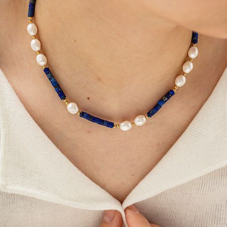 Close-up of the pearl and lapis lazuli necklace showcasing its detailed craftsmanship.
