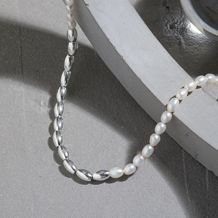 18K Gold PVD Plated Wholesale 925 Silver Freshwater Rice Pearl Necklace Set of 5 - Close-up of a 925 sterling silver necklace with natural freshwater rice pearls, part of a wholesale set.