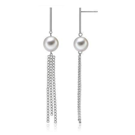 Detailed view of the Cast Line earrings highlighting the white pearls and crystal chains.