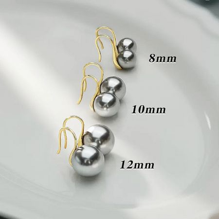 Comparison of 8mm, 10mm, and 12mm grey pearl earrings to illustrate size options.