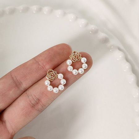 Gold Plated Hollow-Out Rose Flower Pearl Stud Earrings (5 pairs) - A pair of gold plated hollow-out rose flower stud earrings with a central pearl, showcasing the intricate floral design.