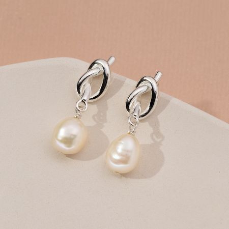 Silver version of the vintage knot pearl drop earrings.