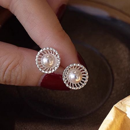 925 Sterling Silver French Style Hollow Shell Pearl Stud Earrings (5 Pairs) - A close-up of the 925 Sterling Silver French Style Hollow Shell Pearl Stud Earrings, highlighting the intricate silver setting and central pearl.