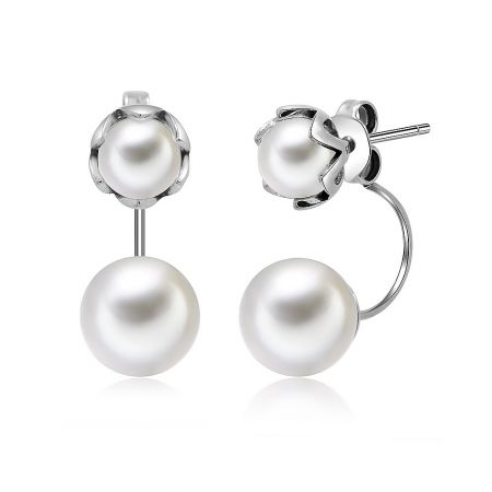 Detailed view of the pearl earrings with sterling silver settings and post-back closure.