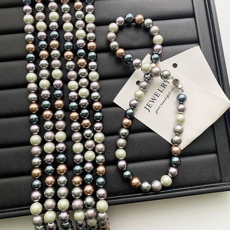 Full collection of Morandi pearl jewelry, including necklaces and bracelets, in a display case.