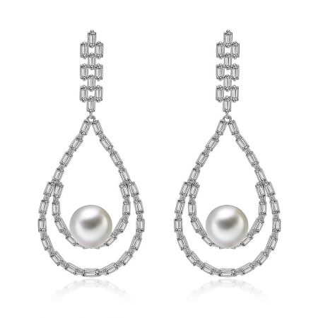 Statement Pearl Dangling Earrings - Front view of the Statement Pearl Dangling Earrings, showcasing the teardrop design with a central shell pearl and surrounding white cubic zirconia stones.