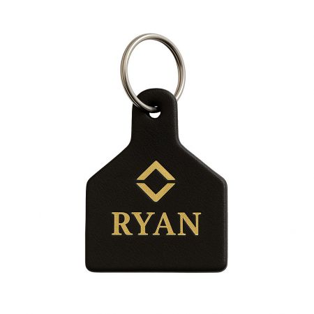 A personalized leather keychain with the name 'RYAN' engraved, perfect for unique corporate or personal gifts.