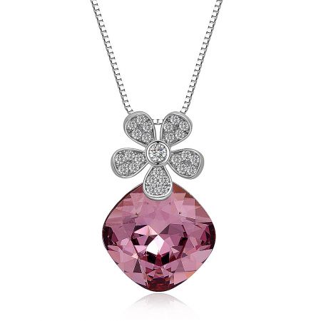 Close-up view of the floral pendant, highlighting the brilliant pink Swarovski crystal and sparkling pavé details.
