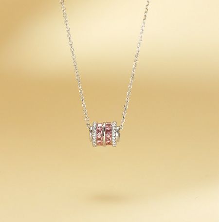 925 Sterling Silver Round Charm Pendant - A close-up of the 925 Sterling Silver Round Charm Pendant (JRS-O01) featuring a sparkling pink cubic zirconia stone on a delicate silver chain.