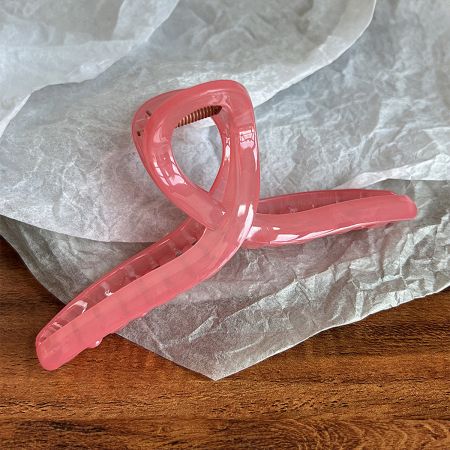 Pink acetate hair jaw clip with French design.